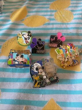 Disney Pins. 6 total. Pin packs included + an extra bag 9 only